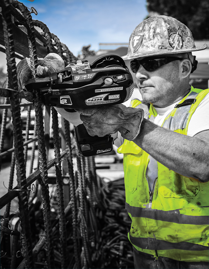 Construction worker receiving a repaired rebar gun
